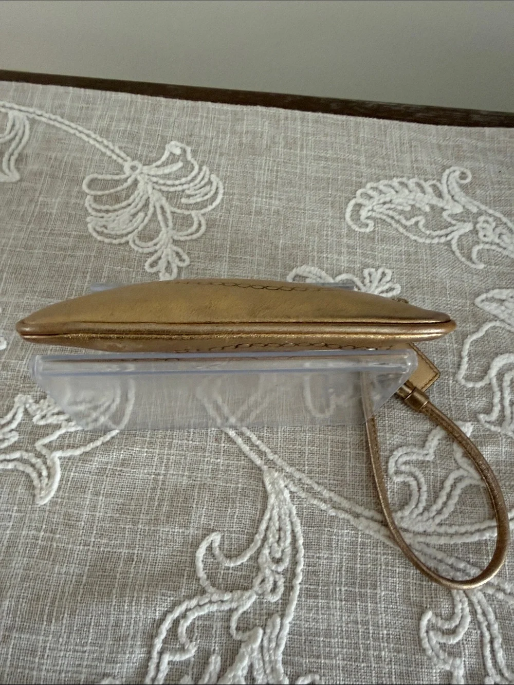 Coach Metallic Gold Wristlet with Embossed Chain Motif